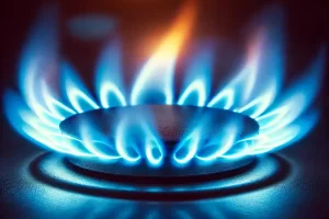 Kék gázláng közelről ég, tiszta és intenzív energiával.